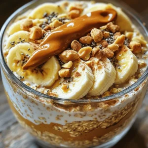 - 1 cup rolled oats - 2 cups almond milk (or your preferred milk) - 2 ripe bananas, sliced (plus extra for topping) - 1/4 cup creamy peanut butter - 2 tablespoons honey or maple syrup - 1/2 teaspoon vanilla extract - 1/2 teaspoon ground cinnamon - A pinch of salt - Chopped nuts - Chia seeds - Extra banana slices - Drizzle of peanut butter The ingredients are simple and easy to find. You can adjust the sweetness with honey or maple syrup. For creaminess, almond milk works great, but feel free to use your favorite milk. The rolled oats are the base, soaking up all the delicious flavors. Sliced bananas add natural sweetness and texture. Creamy peanut butter ties everything together, giving each bite a rich taste. When you mix in vanilla and cinnamon, you create a warm flavor that makes breakfast special. For toppings, the options are endless! You can add chopped nuts for crunch, chia seeds for extra nutrients, or more banana slices for a fresh touch. A drizzle of peanut butter on top adds a nice finishing touch. This recipe is not only tasty but also customizable. You can mix and match to suit your taste. For the full recipe, check out the instructions that guide you through each step with ease. First, grab a large bowl or an airtight container. In it, combine 1 cup of rolled oats with 2 cups of almond milk. This mix creates a creamy base. Next, add in 1/4 cup of creamy peanut butter, 2 tablespoons of honey or maple syrup, 1/2 teaspoon of vanilla extract, 1/2 teaspoon of ground cinnamon, and a pinch of salt. Each ingredient adds flavor and richness to your oats. Now it's time to mix! Whisk the ingredients together until they are well-combined. Make sure the peanut butter gets evenly mixed throughout the oats. This step is key for great flavor. After mixing, gently fold in most of the banana slices. Save a few for topping later. This adds freshness and sweetness to your dish. Once mixed, cover the bowl with a lid or plastic wrap. Place it in the refrigerator overnight. This soaking process helps the oats absorb the milk and flavors. In the morning, take it out and give it a good stir. If the mixture seems too thick, add a splash of almond milk to adjust the consistency. Now your Peanut Butter Banana Overnight Oats are ready to serve! Enjoy them topped with the reserved banana slices, nuts, chia seeds, and a drizzle of peanut butter for extra yum! For the full recipe, check out the above section. To make the best peanut butter banana overnight oats, start with a good container. Use an airtight container for storage. This keeps your oats fresh and tasty. Next, mix the peanut butter well. A smooth blend ensures you get that creamy flavor in every bite. Sometimes, the oats can get too thick. If this happens, simply add more milk. This helps you reach your desired consistency. You can also adjust sweetness. If you like it sweeter, add more honey or maple syrup. Taste as you go to find what you love. Presentation matters! Serve your oats in clear glass jars. This way, you can see the lovely layers of oats and toppings. To make it look even better, garnish with banana slices and nuts. A little extra effort here makes breakfast more exciting. {{image_4}} You can easily change the flavor of your Peanut Butter Banana Overnight Oats. One fun option is to make Chocolate Peanut Butter Banana Overnight Oats. Just add two tablespoons of cocoa powder to the mix. This gives a rich, chocolatey taste. You can also add chocolate chips for extra sweetness. Another idea is to include Fruit and Nut Mix-Ins. Toss in some berries, diced apples, or chopped nuts. This adds texture and flavor. You get to enjoy different tastes each time. For those who follow a vegan diet, you can swap honey with maple syrup. This keeps your oats sweet without using animal products. It’s an easy change that works great. If you need gluten-free options, replace rolled oats with certified gluten-free oats. Always check the labels to ensure they meet your needs. This way, everyone can enjoy a tasty and safe breakfast. Toppings can take your oats to new heights. Consider adding yogurt or granola on top. This gives a creamy or crunchy texture. You can also layer your oats with some yogurt for a delightful treat. Seasonal fruits are a fun way to change it up. Use fresh strawberries in spring or apples in fall. Adding different fruits keeps your meal fresh and exciting. You can mix and match to suit your taste. For the full recipe, check out [Full Recipe]. To keep your Peanut Butter Banana Overnight Oats fresh, store them in an airtight container. The oats will stay good for up to five days in the fridge. Just make sure to cover them tightly to prevent any smells from seeping in. You can prepare these oats in bulk for the week. Make several jars at once and mix different flavors. Consider adding berries, chocolate, or nuts for future variations. This way, you have quick breakfasts ready to go. If you prefer warm oats, you can reheat them in the microwave. Heat in short bursts, stirring in between. This helps keep the texture creamy. If they seem a bit thick, add a splash of almond milk to revive them. Enjoy your tasty breakfast! Peanut Butter Banana Overnight Oats can last up to five days in the fridge. Store them in airtight containers. The oats keep well, and the flavors develop nicely. After a few days, the oats may become softer but still taste great. I recommend eating them within three days for the best texture. Yes, you can use other types of milk. Try cow's milk, soy milk, or oat milk. Each milk brings a different flavor and creaminess. If you prefer nut-free options, go for oat or soy milk. The key is to pick a milk that you enjoy. You can use agave syrup, brown sugar, or stevia. Each substitute adds sweetness. If you're vegan, agave syrup is a great choice. Brown sugar gives a warm flavor, while stevia is low-calorie. Adjust the amount based on your taste preference. You can also skip sweeteners if you like it less sweet. This blog post explored the easy steps to make Peanut Butter Banana Overnight Oats. You learned about the main and flavoring ingredients, how to prepare and mix them, and tips for storage and serving. These oats are fun to customize for your taste. They are healthy, quick, and perfect for meal prep. Try different toppings or variations to keep things exciting. This dish fits any diet and is great for breakfast or snacks. Enjoy your tasty creation, and make it your own!
