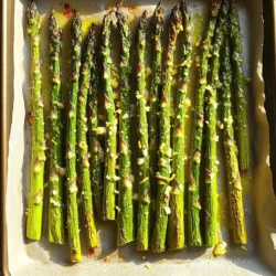 For a delicious Lemon Garlic Roasted Asparagus, gather these simple items: - 1 pound fresh asparagus, trimmed - 3 tablespoons extra virgin olive oil - 4 cloves garlic, finely minced - Zest of 1 medium lemon - Juice of 1 medium lemon - 1 teaspoon sea salt - ½ teaspoon freshly ground black pepper - ¼ teaspoon red pepper flakes (optional for a hint of heat) - 2 tablespoons freshly grated Parmesan cheese (optional for a savory touch) If you want to change things up, here are some great swaps: - Use avocado oil instead of olive oil for a different flavor. - Try shallots if you don’t have garlic. They add a mild sweetness. - Lemon juice can be swapped with lime juice for a tangy twist. - No Parmesan? Use nutritional yeast for a dairy-free option. Choosing fresh asparagus is key for great flavor. Here’s how to pick the best: - Look for bright green color with no brown spots. - The stalks should be firm and straight, not limp. - Check the tips; they should be closed and compact. - Thicker asparagus has a meatier texture, while thinner ones are tender. Enjoy making this dish with fresh ingredients! For the full recipe, check out the details above. 1. Start by preheating your oven to 425°F (220°C). This heat is key for roasting. 2. Wash the asparagus under cool water to clean it. Trim off the tough ends. 3. Use a large bowl to mix 3 tablespoons of olive oil, 4 minced garlic cloves, the zest, and juice of 1 lemon. Add 1 teaspoon of sea salt, ½ teaspoon of black pepper, and ¼ teaspoon of red pepper flakes if you like some heat. Whisk until well-blended. 4. Add the trimmed asparagus to the bowl. Toss gently to coat every spear with the lemon garlic mix. 5. Line a baking sheet with parchment paper. This helps the asparagus not stick. 6. Spread the asparagus in a single layer on the sheet. This allows for even roasting. 7. Roast in the oven for about 12-15 minutes. Look for bright green color and a tender-crisp texture. 8. If you want a savory touch, sprinkle 2 tablespoons of grated Parmesan cheese over the asparagus in the last 2 minutes of roasting. This adds a nice finish. 9. Once roasted, take the asparagus out of the oven. Let it cool for about a minute. 10. Serve immediately! For a pretty look, garnish with extra lemon zest. 11. Arrange the asparagus on a nice platter. Drizzle with a bit of olive oil and salt for extra flavor. This method will give you the best Lemon Garlic Roasted Asparagus. Follow the steps for a tasty side dish every time! For the full recipe, check the earlier section. To roast asparagus perfectly, you need high heat. Preheat your oven to 425°F (220°C). This hot oven helps the asparagus cook well. Spread the asparagus in a single layer. This step allows the hot air to reach every spear. Keep an eye on the time. Roast for 12 to 15 minutes until they look bright green and tender-crisp. You can add extra flavor with a few simple tricks. Try adding lemon zest for a fresh kick. If you like heat, sprinkle in red pepper flakes. A touch of Parmesan cheese adds a savory twist too. Lastly, drizzle a bit of extra virgin olive oil before serving. This makes the dish even more appealing. One common mistake is overcrowding the baking sheet. If the spears touch, they will steam instead of roast. Another mistake is not trimming the tough ends. Always cut off the hard parts for a better bite. Lastly, don’t skip the seasoning. Salt and pepper are key to making the flavors pop. For more details, check out the Full Recipe. {{image_4}} You can easily swap ingredients in this recipe. If you want a nutty flavor, try adding nuts like almonds or walnuts. For a dairy-free option, skip the Parmesan cheese or use a plant-based version. You can also replace olive oil with avocado oil for a different taste. If you like spices, add a pinch of cumin or paprika to the mix. These simple swaps can change the dish without losing its essence. You can cook asparagus in different ways. Grilling gives it a smoky flavor. Simply toss the asparagus in the same lemon garlic mix and place it on the grill. Cook for about 5-7 minutes, turning often until it’s tender. Steaming is another great method. It keeps the asparagus crisp and bright green. Just steam it for 3-5 minutes before tossing it with the lemon garlic mixture. Both methods bring out unique flavors! You can add herbs and spices to make this dish even better. Fresh herbs like parsley or thyme can brighten the flavor. If you love a bit of heat, add more red pepper flakes or some chili powder. A squeeze of lime can work well too. These combinations can enhance the taste and make the dish your own. Try experimenting with different flavors to find your favorite mix! After enjoying your Lemon Garlic Roasted Asparagus, you might have some left. Let the asparagus cool to room temperature. Then, place it in an airtight container. Store it in the fridge for up to three days. If you want to keep it fresh longer, consider freezing it. To reheat your leftovers, preheat your oven to 350°F (175°C). Spread the asparagus evenly on a baking sheet. Heat it for about 5-7 minutes or until it’s warm. You can also use the microwave. Place the asparagus on a microwave-safe plate and cover it with a damp paper towel. Heat in short bursts of 30 seconds, checking often. If you want to freeze the asparagus, start by blanching it. Boil it for 2-3 minutes, then plunge it into ice water to stop cooking. Drain and dry the asparagus before placing it in a freezer bag. Remove excess air and seal it tightly. Store in the freezer for up to 3 months. When you're ready to use it, there’s no need to thaw. Just roast it directly from frozen for an easy meal. For the full recipe, check out the earlier sections. Roast asparagus for about 12 to 15 minutes. The time can change based on your oven. Look for a bright green color and a tender-crisp texture. If you want them softer, roast longer. Just be careful not to overcook them. Yes, you can use frozen asparagus. However, fresh asparagus gives the best taste and texture. If using frozen, thaw them first and pat them dry. This helps avoid sogginess when roasting. Adjust the roasting time to about 10 to 12 minutes for frozen asparagus. You can pair Lemon Garlic Roasted Asparagus with many dishes! It goes great with grilled chicken, baked fish, or even pasta. It makes a colorful side for any meal. You can also serve it with a fresh salad or a grain dish like quinoa for a balanced plate. For the full recipe, check the section above. We explored how to prepare and enjoy delicious Lemon Garlic Roasted Asparagus. You learned about the best ingredients and where to find fresh asparagus. I shared step-by-step cooking methods and tips for perfect roasting. You can try easy variations and flavor swaps to keep it exciting. Remember to store leftovers properly for future meals. This simple dish brightens any meal. Enjoy experimenting with the recipe and sharing it with others!