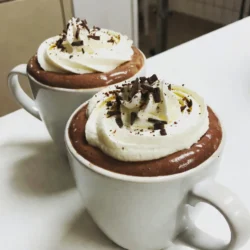 To make a delicious Baileys hot chocolate, you will need: - 2 cups whole milk - 1 cup heavy cream - 1/4 cup unsweetened cocoa powder - 1/2 cup semi-sweet chocolate chips - 1 tablespoon sugar (adjust to taste) - 1 teaspoon pure vanilla extract - 1/4 cup non-alcoholic Irish cream-flavored syrup - Whipped cream (for decadent topping) - Chocolate shavings or a light dusting of cocoa powder (for elegant garnish) You can swap some ingredients if needed. Use almond milk or oat milk for a dairy-free version. You can replace heavy cream with coconut cream for a lighter option. Try dark chocolate chips if you prefer a richer taste. If you want it sweeter, use flavored syrups like caramel or hazelnut instead of sugar. I love using brands that provide quality ingredients. For milk, I choose Horizon Organic for its creaminess. For chocolate chips, Guittard has a great semi-sweet option. If you want a good cocoa powder, try Ghirardelli. For the Irish cream-flavored syrup, Torani is a trusted brand. You can find whipped cream brands like Reddi-wip that are perfect for topping. {{ingredient_image_2}} Start by gathering your ingredients. You need whole milk, heavy cream, cocoa powder, chocolate chips, sugar, vanilla extract, and Irish cream syrup. In a medium saucepan, pour in the whole milk and heavy cream. Place it over medium heat. Heat the mixture until it steams, but do not let it boil. Boiling can change the texture and taste. Once you see steam, whisk in the unsweetened cocoa powder and sugar. Keep whisking until they blend well. The mixture should look smooth and rich. Next, add the semi-sweet chocolate chips. Whisk until they melt completely. This step gives your hot chocolate that velvety feel. After that, remove the saucepan from heat. Stir in the vanilla extract and Irish cream syrup. Mix well and taste it. If you want it sweeter, add more sugar. Temperature is key for this recipe. Heating the milk and cream too fast can cause a boil. You want a gentle heat to keep the hot chocolate smooth. Use a medium setting on your stove. Stir often to prevent any sticking. If your mixture starts to bubble, lower the heat. You want it steaming, not boiling. This will help keep the rich texture. To make your hot chocolate extra creamy, use whole milk and heavy cream. They add richness that low-fat milk cannot. The chocolate chips should be semi-sweet for a balanced flavor. If you like it sweeter, adjust the sugar. Topping it with whipped cream adds a nice texture and taste. For a fancy touch, use chocolate shavings or a dusting of cocoa powder on top. This makes it look great and taste even better. Enjoy your cozy treat! You can make your Baileys hot chocolate truly yours. Here are some easy ideas: - Flavors: Add a splash of peppermint extract for a minty twist. Try a hint of orange zest for a fruity kick. You can even mix in a spoonful of espresso for a mocha flavor. - Sweetness: Adjust the sugar to fit your taste. If you love it sweet, add more sugar. If you prefer less, cut back. - Toppings: Get creative with toppings! Use marshmallows, crushed candy canes, or even a drizzle of caramel. You can serve this drink for many events. Here are some fun ideas: - Cozy Nights: Make it on a cold night while watching a movie. Pair it with your favorite snacks for a perfect evening. - Holiday Gatherings: Serve at holiday parties. Set up a hot chocolate bar with toppings and let guests create their own treats. - Gifts: Fill mason jars with the dry ingredients. Attach a note with the recipe, and gift it to friends. To make the best Baileys hot chocolate, avoid these common errors: - Boiling the Milk: Always heat the milk slowly. Boiling can make it taste burnt and change the texture. - Not Whisking Enough: Whisk well to combine the cocoa and sugar. This ensures a smooth drink without lumps. - Skipping the Toppings: Don&rsquo;t skip the whipped cream and garnishes. They add flavor and look beautiful. These tips will help you craft the perfect Baileys hot chocolate every time. Enjoy your cozy treat! Pro Tips Use High-Quality Chocolate: Opt for premium semi-sweet chocolate chips to enhance the flavor and richness of your hot chocolate. Adjust Sweetness to Taste: Start with the recommended sugar amount, but feel free to add more depending on your sweetness preference. Experiment with Flavors: Try adding a pinch of cinnamon or a drop of peppermint extract for a unique twist on the classic recipe. Serve Immediately: For the best experience, serve your hot chocolate right after making it while it's warm and creamy. {{image_4}} You can easily change the taste of Baileys Hot Chocolate. Try adding peppermint for a minty kick. Just add a few drops of peppermint extract. You can also mix in mocha flavors. Use a shot of espresso or some coffee. This will give your drink a rich coffee vibe. If you want a non-dairy version, use almond milk or oat milk. These choices still taste great and keep your drink creamy. Use coconut cream for a thicker texture. It adds a tropical twist too. You can also find non-dairy whipped cream for topping. For special occasions, you can add seasonal flavors. Try using pumpkin spice in the fall. It brings warmth and comfort on chilly days. During the holidays, you can add a splash of eggnog for a festive touch. This gives the drink a creamy, rich flavor. You can also top it with gingerbread crumbles for fun. To store leftovers, let your hot chocolate cool first. Pour it into an airtight container. Seal it well and keep it in the fridge. Use the leftovers within three days for the best taste. When you're ready to enjoy your hot chocolate again, pour it into a pot. Heat it on low until warm. Stir it often to keep it smooth. If you prefer, you can also use a microwave. Heat in short bursts, stirring in between. Most of the ingredients last a long time. Whole milk and heavy cream can last about a week in the fridge. Cocoa powder and sugar can sit in your pantry for months. Chocolate chips usually stay fresh for a year if stored right. Always check for any signs of spoilage before using. Baileys Hot Chocolate is a warm drink made with rich chocolate and Baileys Irish cream. This drink is smooth and creamy. It is a perfect treat for cold days. You blend hot chocolate with Baileys to get a sweet kick. The drink has layers of flavor that warm you up inside. Yes, you can enjoy Baileys Hot Chocolate without the alcohol. You can use a non-alcoholic Irish cream-flavored syrup instead. This gives you the same taste without the booze. The recipe I provided calls for this syrup. It adds a rich flavor without any alcohol. You can still enjoy the warm chocolate goodness! To make Baileys Hot Chocolate richer, use heavy cream in your mix. Heavy cream adds a thick, smooth texture. You can also add more chocolate chips for a deeper taste. Mixing in a little extra cocoa powder will enhance the chocolate flavor. Finally, top it with a generous amount of whipped cream for extra richness. We reviewed the key ingredients for Baileys Hot Chocolate and discussed substitutions. I shared step-by-step instructions to help you cook it just right, maintaining proper temperature and flavor. You learned tips for customizations and serving, avoiding common errors. We also explored fun variations and how to store your drink. So, whether you want a classic recipe or a festive twist, you can enjoy a warm treat. Using these insights, you can craft your perfect Baileys Hot Chocolate!