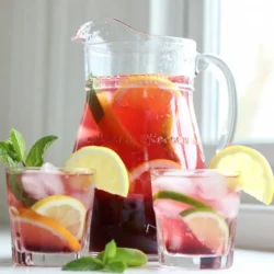 - 4 cups freshly squeezed orange juice - 2 cups freshly squeezed grapefruit juice - 1 cup unsweetened cranberry juice - 1 cup sparkling water or soda The main ingredients for Christmas Morning Citrus Punch start with freshly squeezed juices. I love using fresh oranges and grapefruits. They give the punch a bright, zesty flavor. The unsweetened cranberry juice adds a nice balance. It brings a slight tartness that complements the sweeter juices. Lastly, the sparkling water or soda adds a fun fizz. This bubbly touch makes the drink feel festive and special. - 1/2 cup honey - 1/2 cup agave syrup For sweetening, you can use honey or agave syrup. Both are great choices. Honey gives a rich flavor, while agave syrup is milder. You can adjust the sweetness to your taste. Start with a little and add more if needed. This way, you get the perfect balance for your punch. - 1 lemon, thinly sliced - 1 lime, thinly sliced - Fresh mint leaves Garnishes add a lovely touch to your punch. I like to use thin slices of lemon and lime. They look nice and add extra flavor. Fresh mint leaves are a must too. They not only make the drink look pretty but also add a fresh aroma. When you serve the punch, these garnishes make it pop! {{ingredient_image_2}} First, grab a large pitcher. Pour in 4 cups of freshly squeezed orange juice. Next, add 2 cups of freshly squeezed grapefruit juice. Then, pour in 1 cup of unsweetened cranberry juice. Take a long spoon and stir the juices together well. Now, it&rsquo;s time to sweeten your punch. Slowly whisk in 1/2 cup of honey or agave syrup. Keep stirring until it dissolves. Taste it! If you want it sweeter, add more honey or syrup. Cover the pitcher with a lid or plastic wrap. Place it in the refrigerator. Chill for at least 30 minutes. This step is key. It helps the flavors mix and taste better. Before serving, carefully add 1 cup of sparkling water or soda to the pitcher. Gently stir to keep the fizz. Next, fill your serving glasses with ice cubes. Pour the refreshing punch over the ice, filling each glass generously. Finally, for a festive touch, garnish each glass. Add a thin slice of lemon and a slice of lime. Finish with a few fresh mint leaves on top. This not only looks great but smells good too! You can easily adjust the sweetness to fit your taste. Start with 1/2 cup of honey or agave syrup. Stir it in well and taste. If you want it sweeter, add more sweetener a little at a time. This punch should be just right for you and your guests. Serve the punch in clear glasses. This lets everyone see the bright colors of the drink. For garnish, add a slice of lemon and lime to each glass. A sprig of fresh mint on top adds a nice touch. It looks great and smells wonderful. You can make this punch in advance. Mix all the juices and sweetener in a pitcher. Cover and chill in the fridge for at least 30 minutes. Just before serving, add the sparkling water or soda. This keeps the bubbles fresh. Store any leftovers in the fridge for up to two days. Just remember to re-add the sparkling water for fizz! Pro Tips Chill Your Ingredients: For an extra refreshing punch, chill your juices and sparkling water beforehand. This ensures the punch stays cold longer without diluting the flavors with too much ice. Mix and Match Citrus: Experiment with other citrus fruits like tangerines or blood oranges for a unique twist on the classic recipe. It adds depth and a beautiful color variation. Sweetness Level: Adjust the sweetness of your punch by tasting it after adding the honey or agave syrup. Everyone's preference for sweetness varies, so it&rsquo;s best to customize it to your liking. Garnish with Style: Use thin slices of colorful citrus and fresh herbs like rosemary or basil along with mint for a stunning presentation. This not only looks beautiful but also enhances the aroma. {{image_4}} You can switch up the fruits in your punch. Other citrus options include tangerines, lemons, or even blood oranges. Each brings its unique flavor. For a seasonal twist, add cranberries or pomegranate seeds. They not only taste great but also look beautiful. You can make this punch for everyone. For a family-friendly version, keep it non-alcoholic. If you want an adult drink, consider adding spirits. Vodka or gin works well. Just remember to keep the ratios balanced, so the punch remains refreshing. If you prefer healthier choices, use natural sweeteners. Maple syrup or agave syrup adds a lovely touch. You can also try sugar-free options like stevia. Each choice lets you customize the sweetness without losing flavor. You can keep Christmas Morning Citrus Punch in the fridge for up to three days. Store it in a sealed pitcher to keep it fresh. If you want the best flavor, drink it within two days. The longer it sits, the less vibrant the taste becomes. Can you freeze punch? Yes, but it&rsquo;s best to freeze only the juices, not the whole punch. The sparkling water will lose its fizz when thawed. For best practices, pour the juice mixture into ice cube trays. Once frozen, you can store them in a freezer bag. When you&rsquo;re ready to serve, add the cubes to a glass and top with sparkling water. This keeps your drink cold without diluting the flavor. Yes, you can make this punch the night before. Just prepare the juice mixture without the sparkling water. Store it in the fridge. Add the sparkling water right before serving. This keeps the fizz fresh and lively. You can add many fruits to enhance the punch. Consider adding sliced strawberries, diced pineapple, or blueberries. These fruits add color and taste. Feel free to get creative with seasonal fruits that you love. Yes, you can reduce the sweetness easily. Use less honey or agave syrup. You can also add more unsweetened cranberry juice. This will balance the flavors without making it too sweet. Yes, you can use bottled juices. However, fresh juices taste better and have more nutrients. If you use bottled juices, choose ones without added sugars. This helps keep the punch healthy and tasty. To make a larger batch, simply multiply the ingredients. Use a bigger pitcher or bowl. Adjust the sparkling water to maintain the fizz. This way, you can serve more guests and keep the holiday fun going! This punch recipe combines citrus flavors for a refreshing drink. We explored key ingredients, sweetening options, and garnishes. The step-by-step guide makes it easy to prepare and serve. Adding tips helps enhance flavor and presentation. Consider variations for adults or seasonal fruits. In the end, this punch is fun and adaptable. Enjoy it at gatherings or quiet evenings. Try it yourself and get creative!