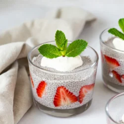 - Almond milk: 1 cup (you can use any milk you like) - Chia seeds: 1/4 cup - Sweetener: 2 tablespoons maple syrup (you can adjust this) - Flavoring: 1 teaspoon pure vanilla extract - Fresh strawberries: 1 cup (hulled and sliced) - Optional ingredient: 1/4 cup coconut yogurt (for extra creaminess) - Garnish: Fresh mint leaves When making strawberry chia pudding, the ingredients matter. Almond milk gives it a smooth base. You can swap almond milk for oat or soy milk if you prefer. Chia seeds are key; they thicken the pudding and add health benefits. They are rich in fiber and omega-3 fatty acids. For sweetness, maple syrup works well, but feel free to use honey or agave syrup. The pure vanilla extract adds depth to the flavor. Fresh strawberries brighten the dish. They are juicy and provide natural sweetness. If you want creaminess, add coconut yogurt. It enhances the mouthfeel and adds a hint of coconut flavor. Lastly, fresh mint leaves add a pop of color and a refreshing touch. All these ingredients work together to create a healthy and creamy delight. Each bite is a treat for both your taste buds and your body. {{ingredient_image_2}} In a medium mixing bowl, pour in 1 cup of almond milk. Add 1/4 cup of chia seeds, 2 tablespoons of maple syrup, and 1 teaspoon of pure vanilla extract. Whisk the mixture for 30 seconds. Make sure there are no clumps of chia seeds left. This step is key to a smooth pudding. Cover the bowl tightly with plastic wrap or a lid. Place it in the refrigerator for at least 4 hours, or overnight if you can wait. This chilling time allows the chia seeds to soak up the almond milk. They will expand and create a creamy, pudding-like texture. After chilling, take the pudding out of the fridge. If it has thickened too much, stir in a little more almond milk. Mix until you reach your desired consistency. Now, let&rsquo;s layer it! Start with a scoop of chia pudding in a serving glass. Add a layer of fresh, sliced strawberries on top. For a creamier touch, include a dollop of coconut yogurt. Repeat the layers until your glass is full. To finish, garnish each serving with a few extra strawberry slices and some fresh mint leaves. This adds a nice touch and makes it look pretty! Enjoy your delicious, healthy treat! To get the right texture, you can adjust the almond milk. If your pudding is too thick, stir in a little more milk. You want it creamy, not runny. The best chilling time for this pudding is four hours. However, overnight works best. This lets the chia seeds soak up the milk fully. For sweetness, you can use other sweeteners. Honey or agave syrup can work well. You can also add spices like cinnamon for a twist. To boost flavor, try adding a splash of lemon juice. For toppings, think about sliced bananas or a handful of nuts. Granola adds a nice crunch. You can also use coconut flakes or additional fresh fruits. This will make your pudding even more delicious. Serving in clear glasses is a fun way to show off layers. You can use mason jars or small bowls for a rustic touch. To make it look appealing, layer the chia pudding and strawberries. Add a dollop of coconut yogurt for creaminess. Finish with mint leaves on top. This not only looks great but tastes fresh too. Pro Tips Perfect Chia Consistency: Ensure you whisk the chia seeds well into the almond milk to avoid clumping and achieve that smooth pudding texture. Sweetness Level: Adjust the amount of maple syrup according to your taste preference; you can always add more sweetness after chilling if needed. Layering Technique: For an aesthetically pleasing presentation, make sure to alternate layers of chia pudding and strawberries carefully in each glass. Chill Time: For best results, let the chia pudding chill overnight; this allows the flavors to meld and the texture to improve significantly. {{image_4}} You can switch up the flavors of your chia pudding easily. Instead of strawberries, try using blueberries or raspberries. These berries add a fun twist and different flavors. You can also add a pinch of spices like cinnamon or nutmeg. These spices give your pudding a warm taste and make it extra special. This pudding is great for many diets. It is vegan-friendly since it uses almond milk. If you want to avoid nuts, you can use oat milk or coconut milk instead. Both are tasty and work well in this recipe. This way, anyone can enjoy the pudding without worry. Layering makes this pudding look beautiful and taste even better. You can add granola, nuts, or seeds between layers. This adds crunch and texture. For a parfait-style serving, use clear glasses to show off the pretty layers. You will impress your friends and family with these fun serving ideas! To store leftover strawberry chia pudding, keep it in an airtight container. This helps maintain freshness and flavor. In the fridge, it stays good for about 3 to 5 days. Always check for any signs of spoilage before eating. If the pudding thickens too much, stir in a little almond milk to restore its creamy texture. Yes, you can freeze chia pudding! Freezing is great for meal prep. Use a freezer-safe container and leave some space at the top. This allows for expansion. When you are ready to eat, move it to the fridge to thaw overnight. To keep the texture smooth, stir it after defrosting. If it looks a bit separated, mix it well. A splash of almond milk can help restore creaminess. Make chia pudding in advance for easy breakfasts. Prepare a batch on Sunday for the week ahead. Portion it into small jars for quick grab-and-go options. This makes mornings much easier! You can also layer it with fruits or granola for added flavor and nutrition. Chia seeds are small but mighty. They are rich in fiber, protein, and omega-3 fatty acids. One ounce of chia seeds has about 137 calories, 11 grams of fiber, and 4 grams of protein. These nutrients help support heart health, improve digestion, and keep you full longer. Chia seeds also contain antioxidants. These protect your body from damage by free radicals. They can help reduce inflammation and improve overall health. By adding chia seeds to your diet, you boost nutrition easily. Yes, you can use different types of milk. While almond milk is great, feel free to try coconut milk, oat milk, or soy milk. Each option adds a unique flavor and texture. If you prefer dairy, whole or low-fat milk works well too. Choosing a milk option depends on your taste and dietary needs. Just ensure it&rsquo;s unsweetened if you want to control sweetness. This way, you can enjoy your pudding just how you like it. Chia pudding can last for up to five days in the fridge. Store it in a sealed container to keep it fresh. You&rsquo;ll know it&rsquo;s time to toss it if you see any mold or it smells off. If the pudding separates, just stir it well before eating. The chia seeds may absorb more liquid over time, making it thicker. You can add a splash of milk to regain a creamier texture. Absolutely! Making chia pudding ahead of time is a smart idea. You can prepare it up to three days in advance. Just make sure to store it in an airtight container in the fridge. This makes breakfast or snacks super easy. You can layer your pudding with fruit or yogurt just before serving. This way, you enjoy a fresh and tasty treat whenever you want. This blog post covered a tasty chia pudding recipe. We discussed key ingredients, like almond milk and chia seeds, and gave step-by-step instructions for preparation. I shared tips to enhance flavor and texture while offering various options for customization. Remember, you can easily adjust sweetness and make this dish your own. In summary, chia pudding is flexible and fun. Enjoy experimenting with flavors and toppings to suit your taste. Get ready to feast on this healthy treat!